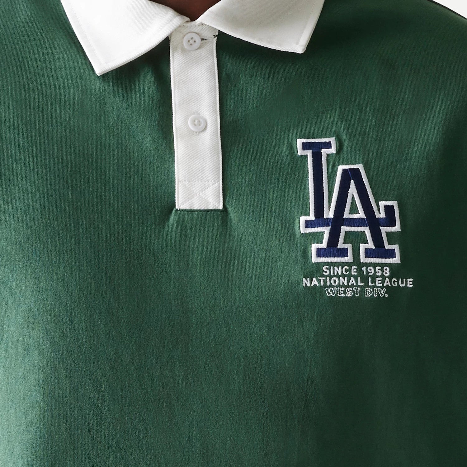 The model is wearing this MLB LA Dodgers Oversized Polo T-Shirt in dark green. 4