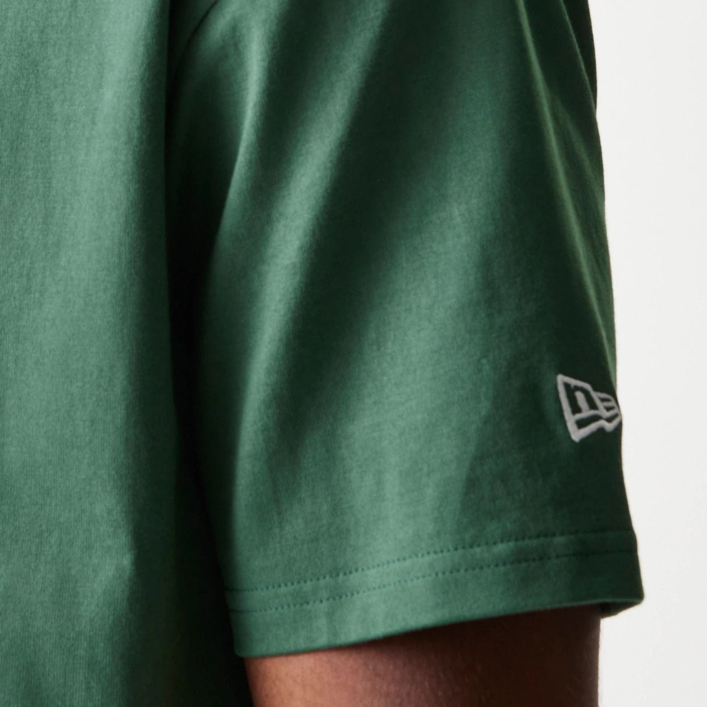 The model is wearing this MLB LA Dodgers Oversized Polo T-Shirt in dark green. 5
