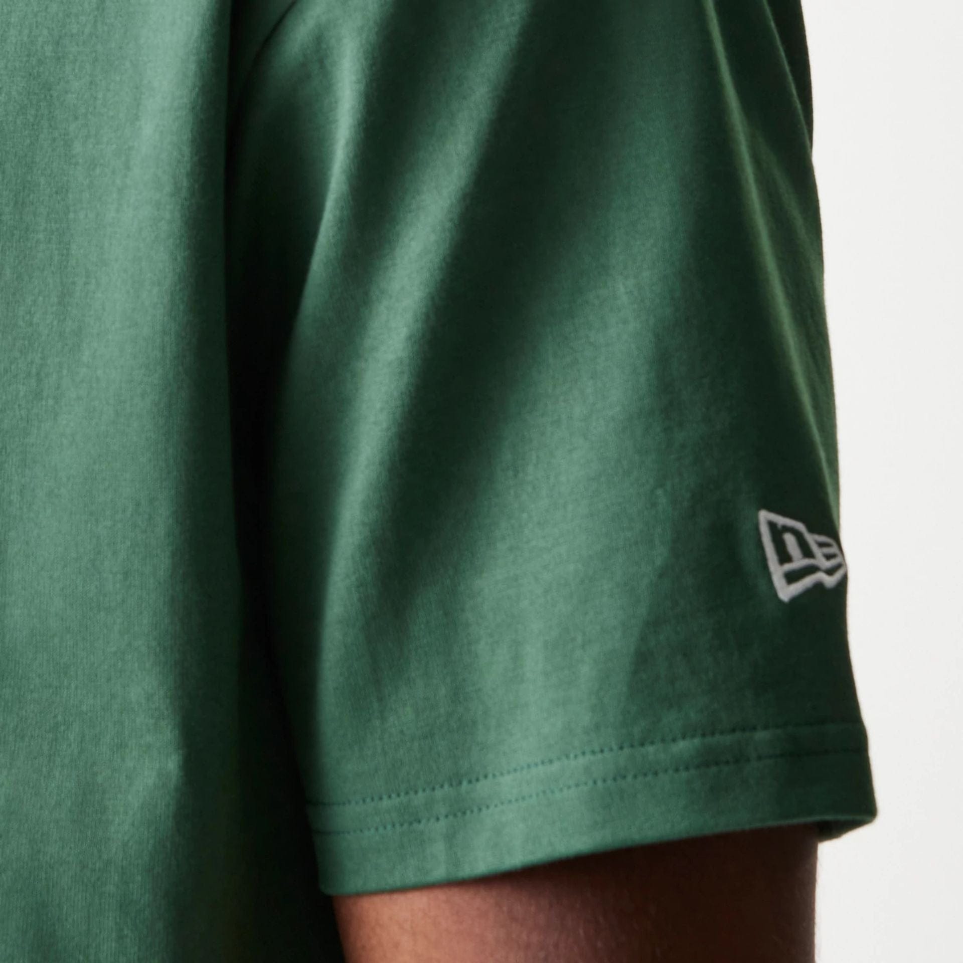 The model is wearing this MLB LA Dodgers Oversized Polo T-Shirt in dark green. 5