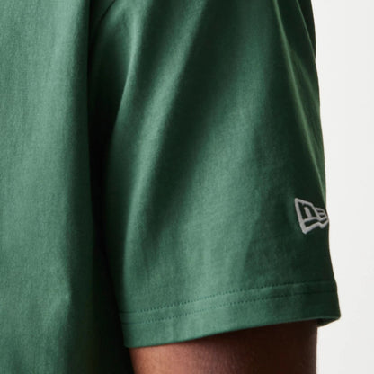 The model is wearing this MLB LA Dodgers Oversized Polo T-Shirt in dark green. 5