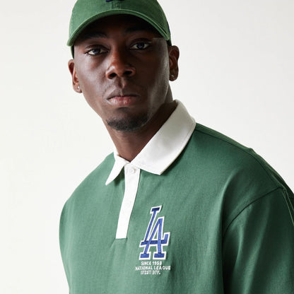 The model is wearing this MLB LA Dodgers Oversized Polo T-Shirt in dark green. 6