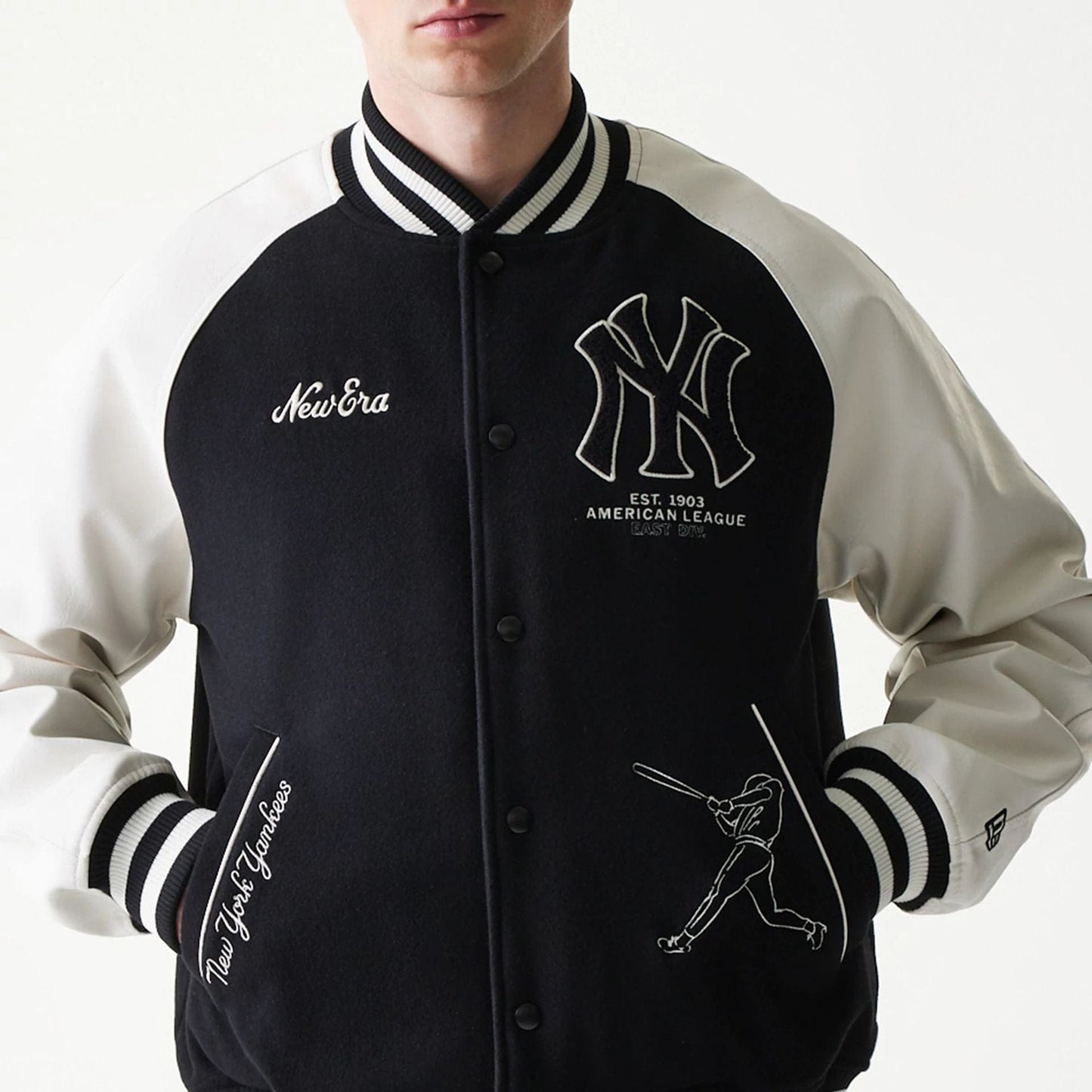 The model is wearing this MLB New York Yankees Varsity Jacket in black. 3