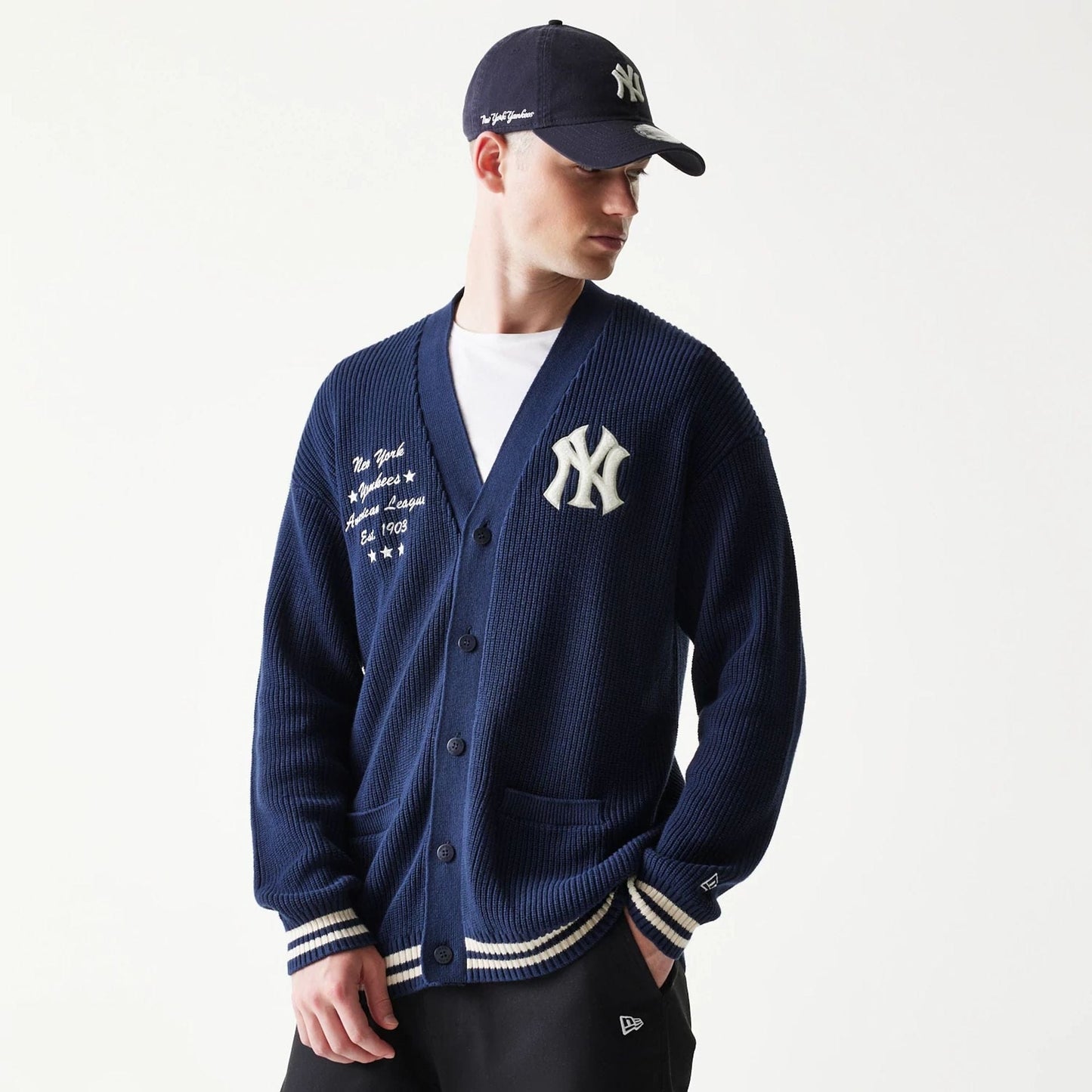 The model is wearing this MLB Collegiate New York Yankees Cardigan in navy. 3