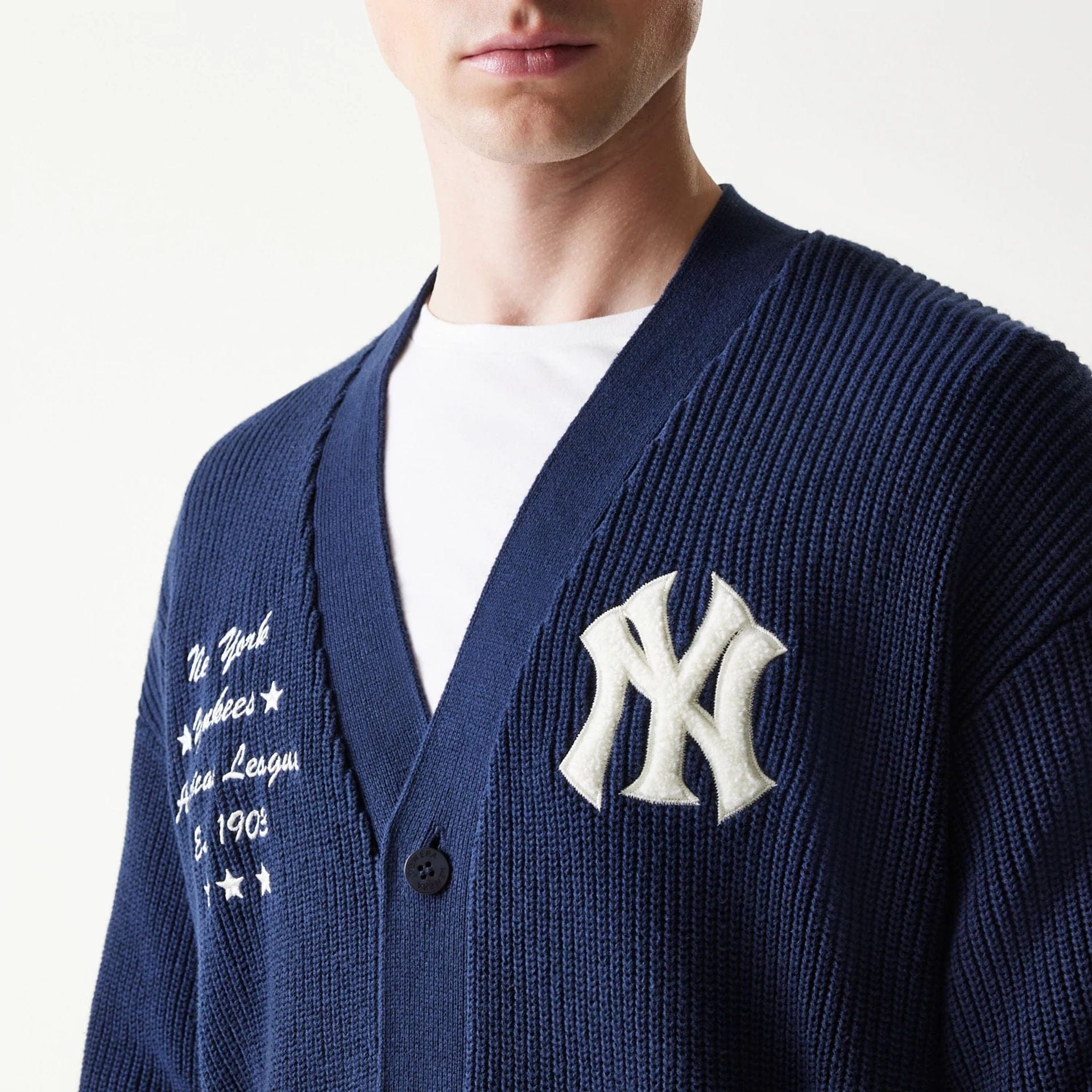 The model is wearing this MLB Collegiate New York Yankees Cardigan in navy. 5