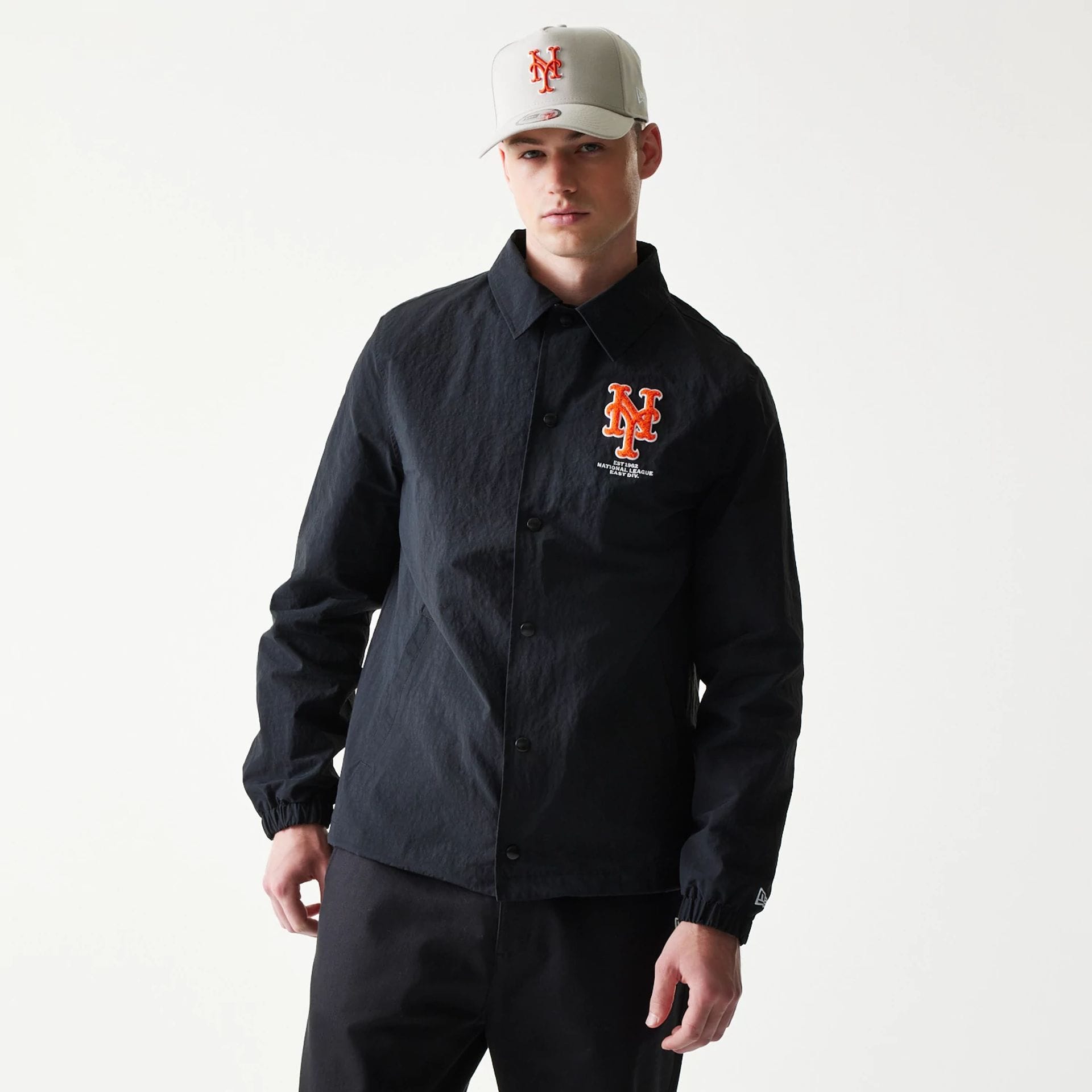The model is wearing this MLB Coaches New York Mets Jacket in black. 3