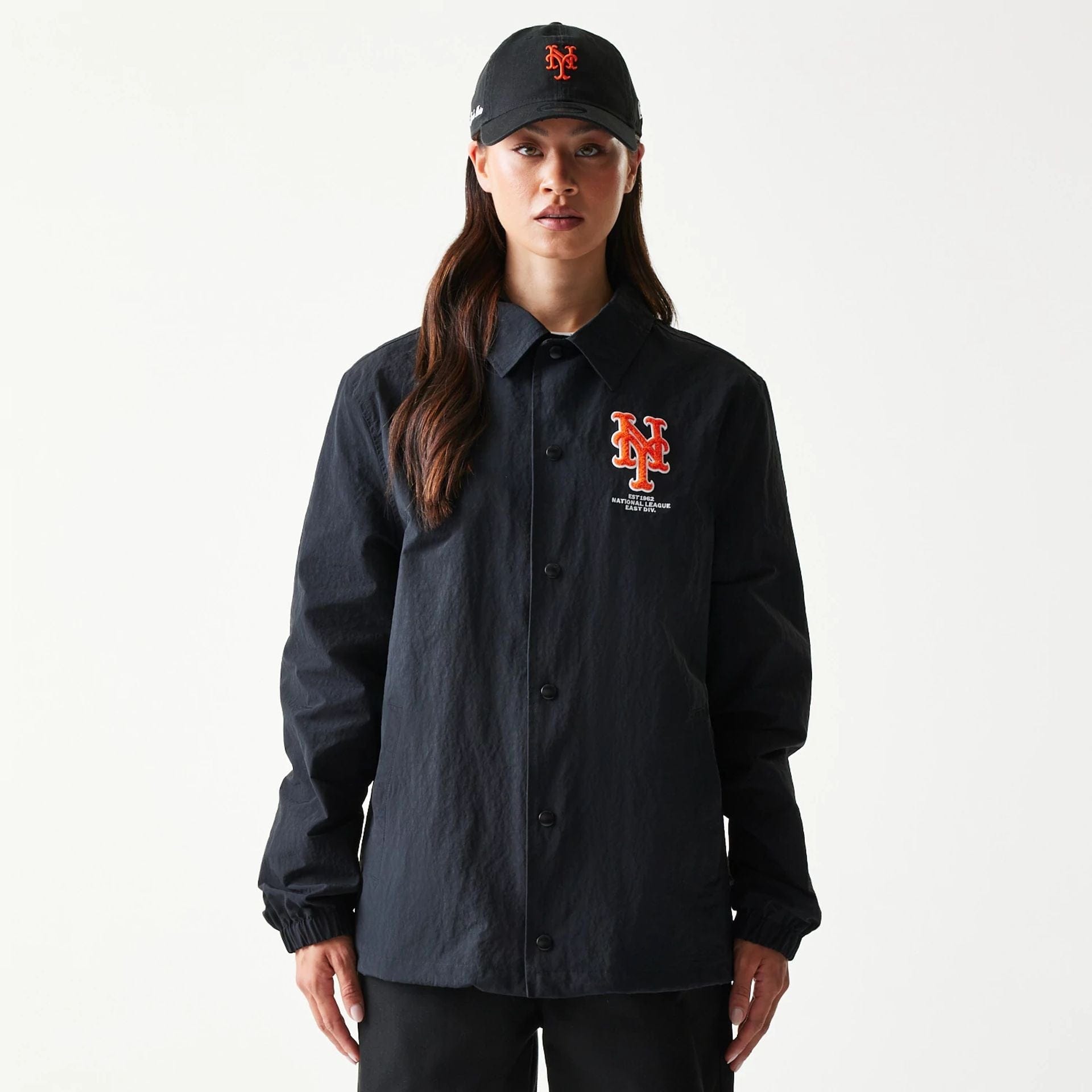 The model is wearing this MLB Coaches New York Mets Jacket in black. 4