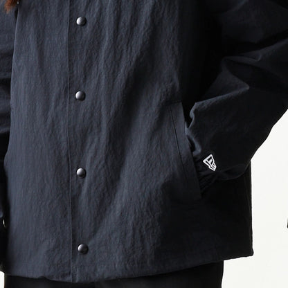 The model is wearing this MLB Coaches New York Mets Jacket in black. 7