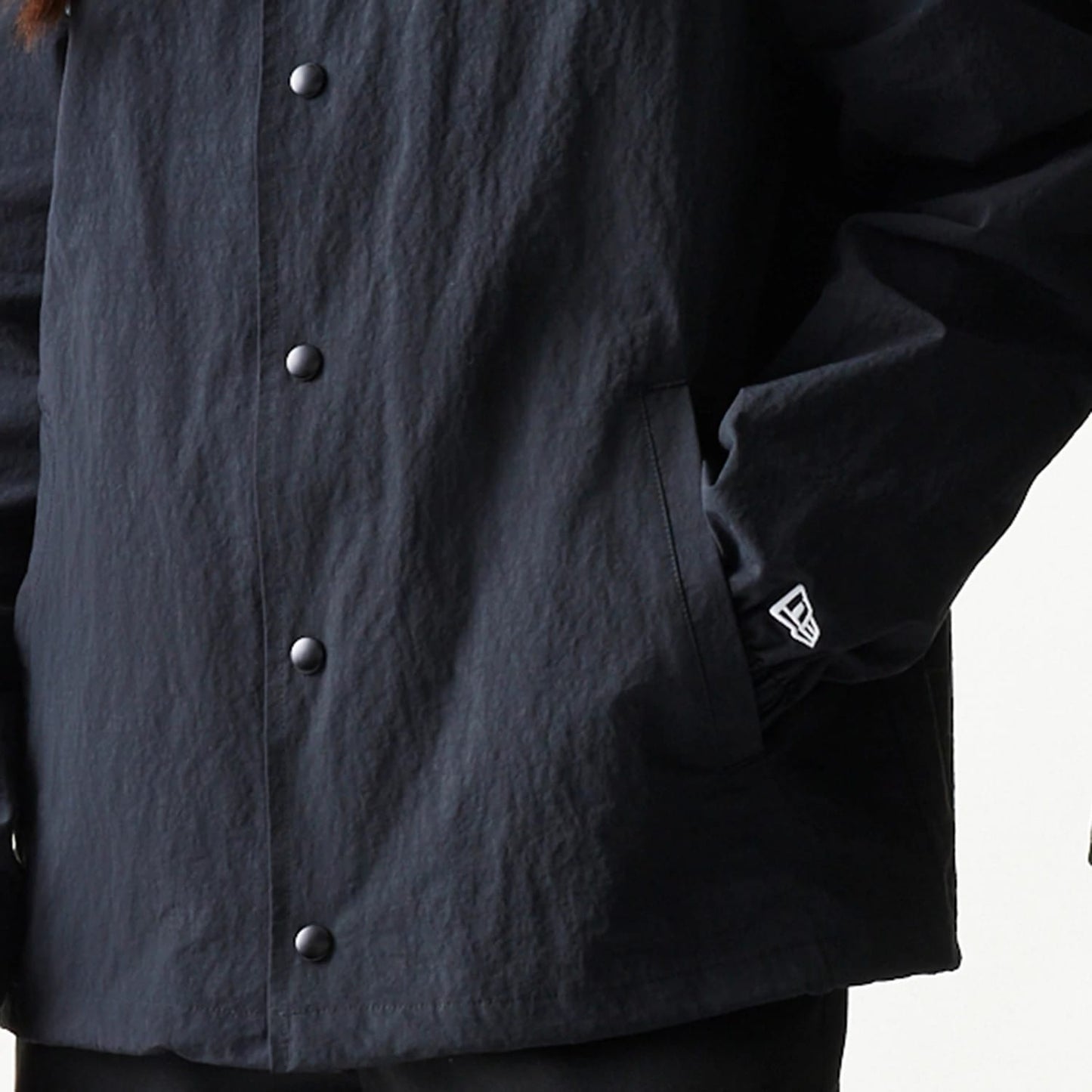 The model is wearing this MLB Coaches New York Mets Jacket in black. 7