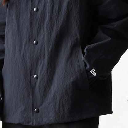 The model is wearing this MLB Coaches New York Mets Jacket in black. 7