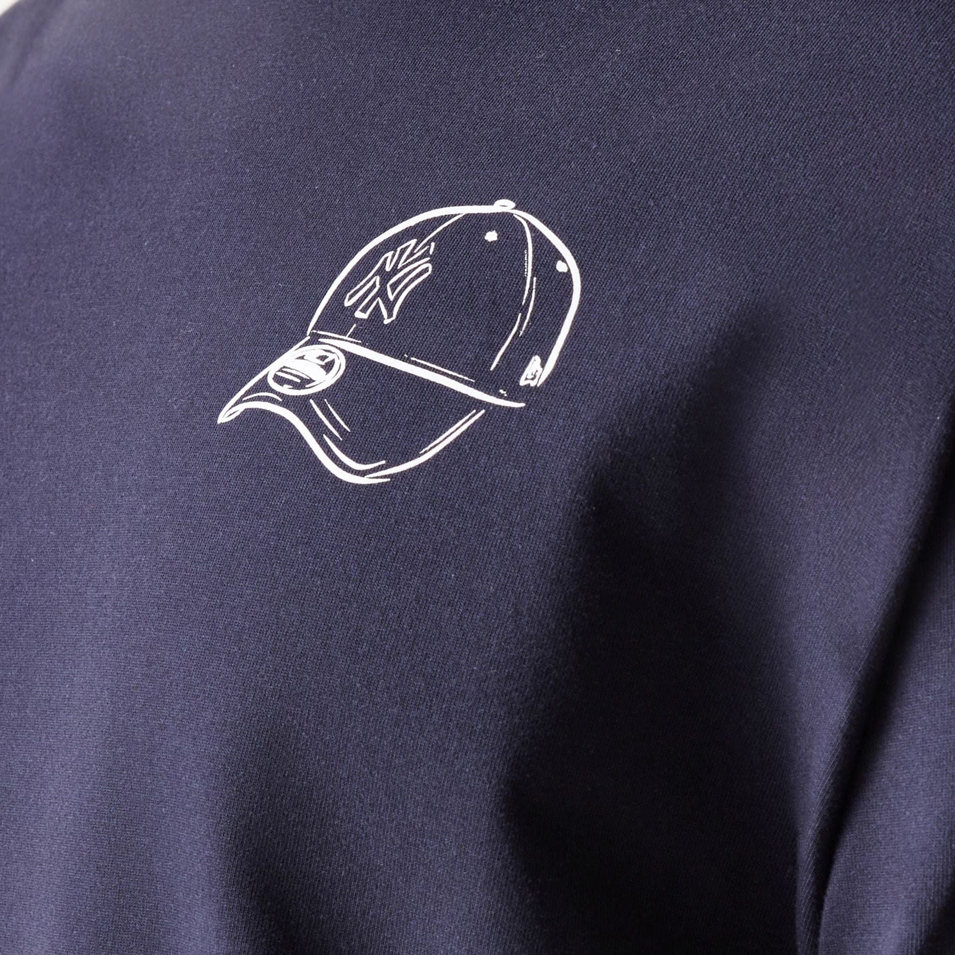 The model is wearing this MLB Baseball Graphic New York Yankees Oversized T-Shirt in navy. 5