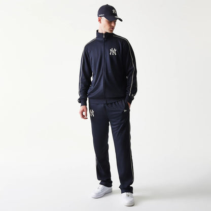 The model is wearing this MLB Piping New York Yankees Straight Leg Joggers in navy. 8