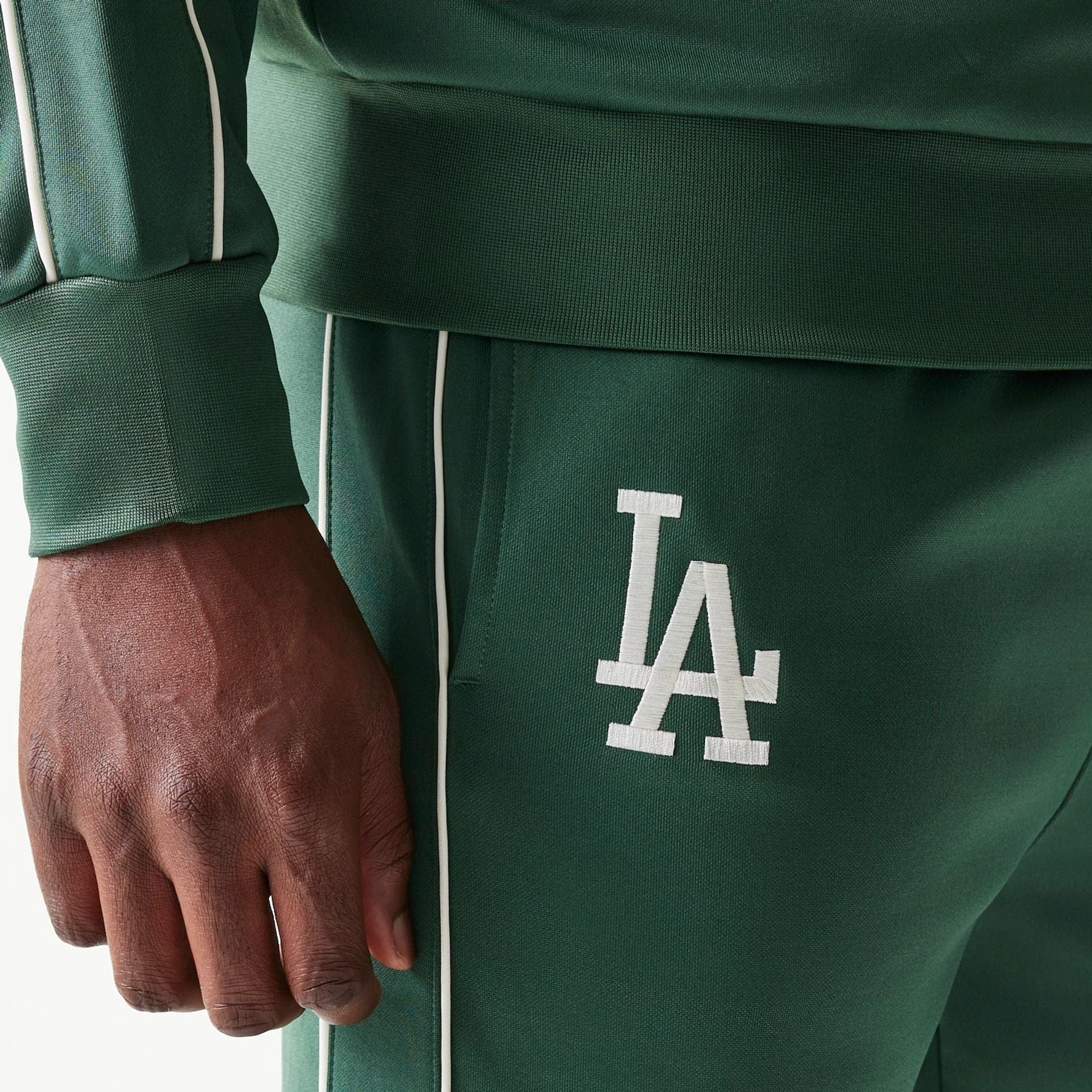 The model is wearing this MLB Piping LA Dodgers Straight Leg Joggers in dark green. 3