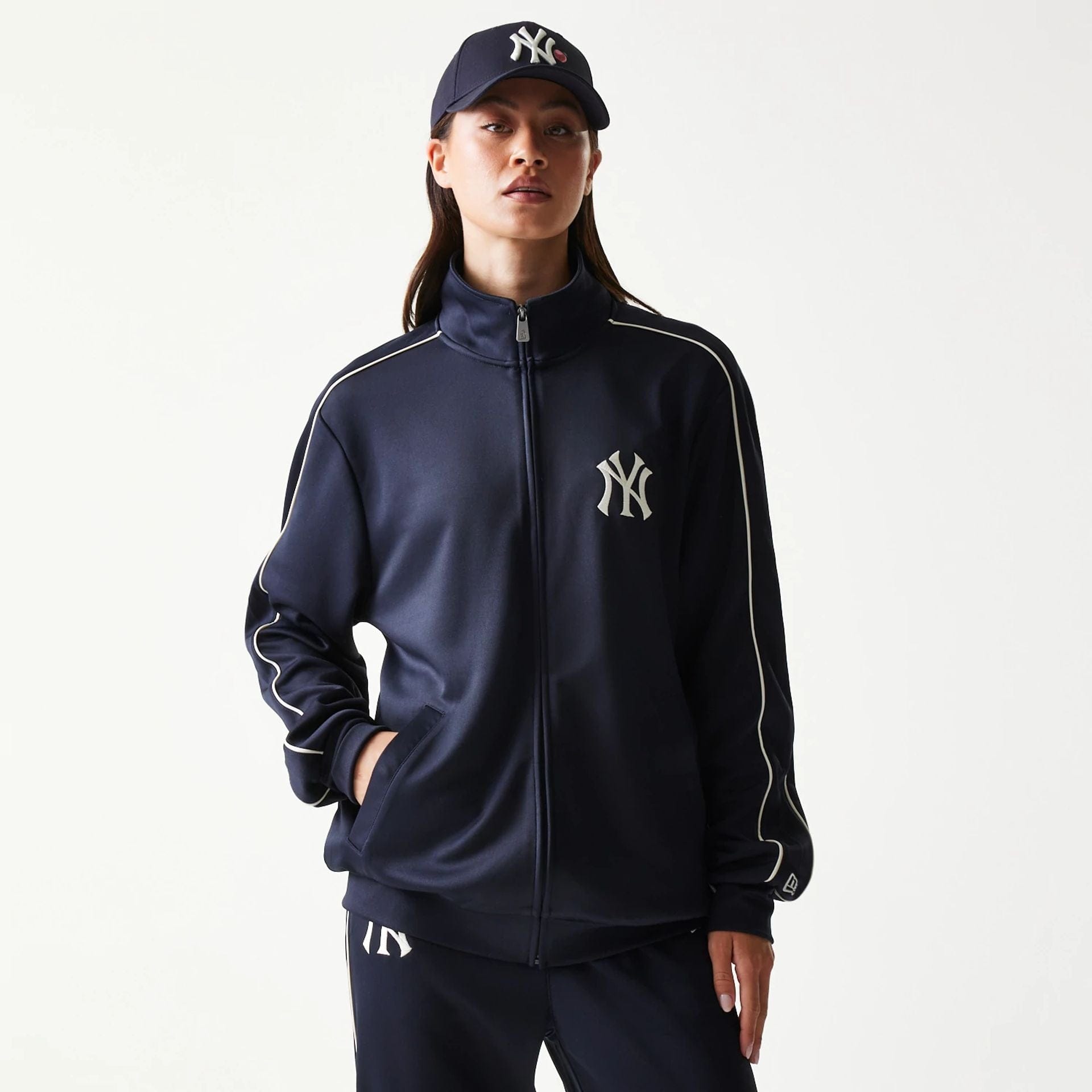 The model is wearing this MLB Piping New York Yankees Track Jacket in navy. 4