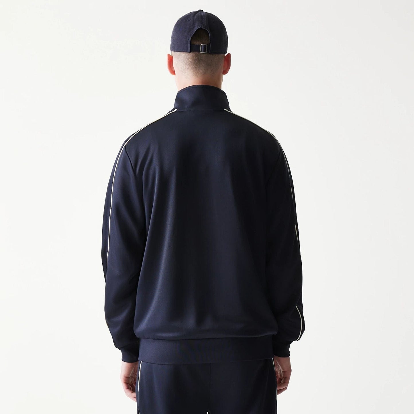 The model is wearing this MLB Piping New York Yankees Track Jacket in navy. 2
