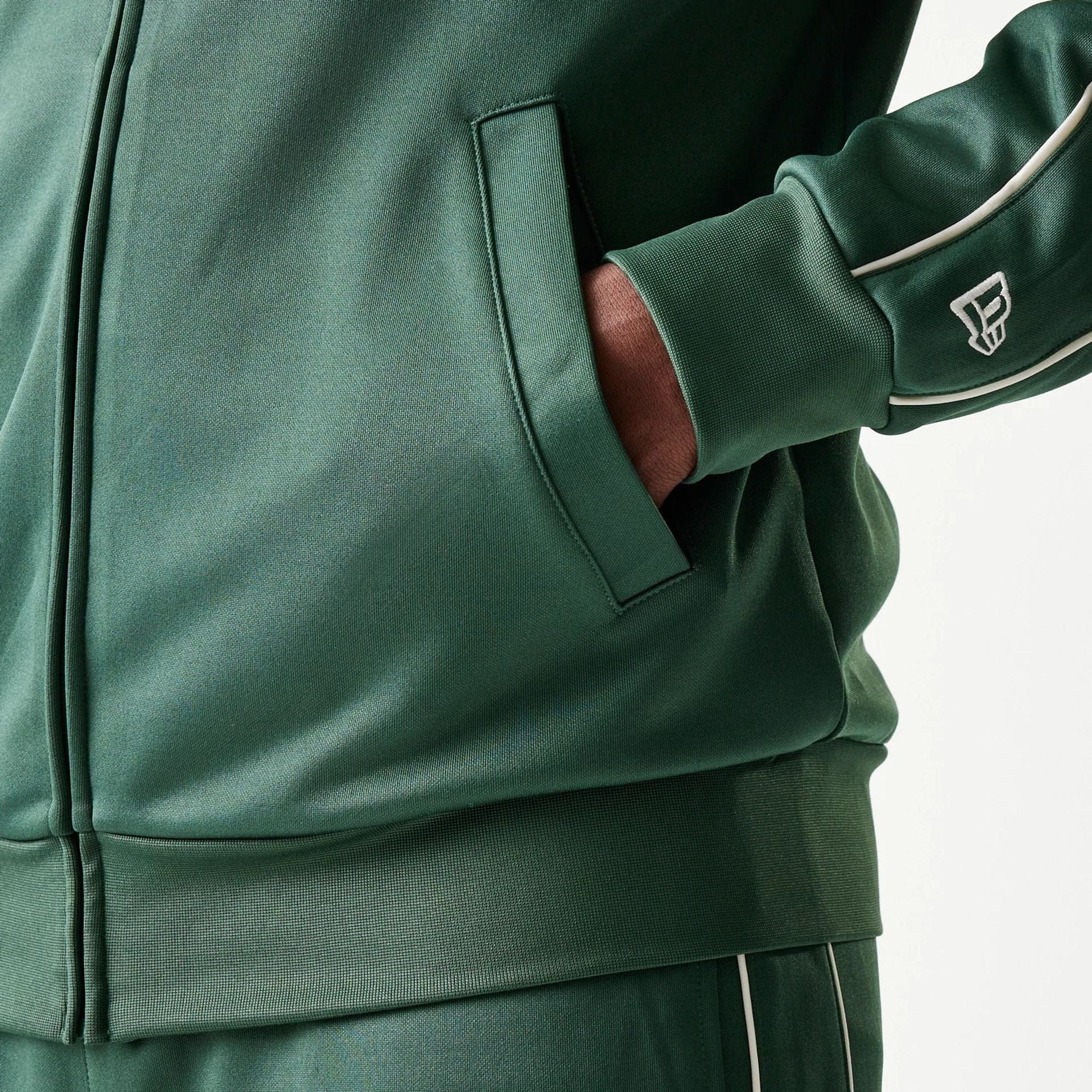 The model is wearing this MLB Piping LA Dodgers Track Jacket in dark green. 5