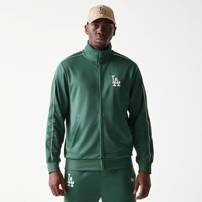 The model is wearing this MLB Piping LA Dodgers Track Jacket in dark green. 1