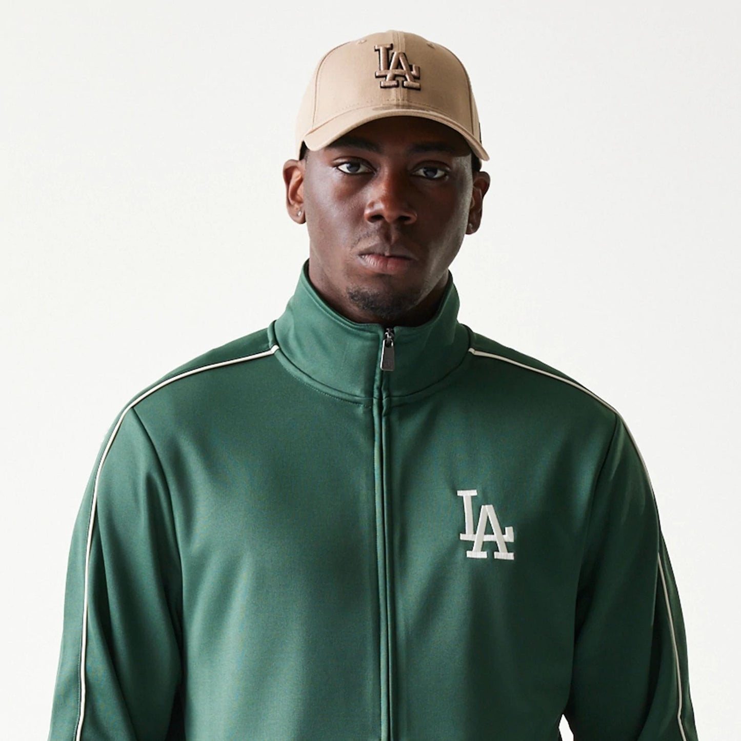 The model is wearing this MLB Piping LA Dodgers Track Jacket in dark green. 6