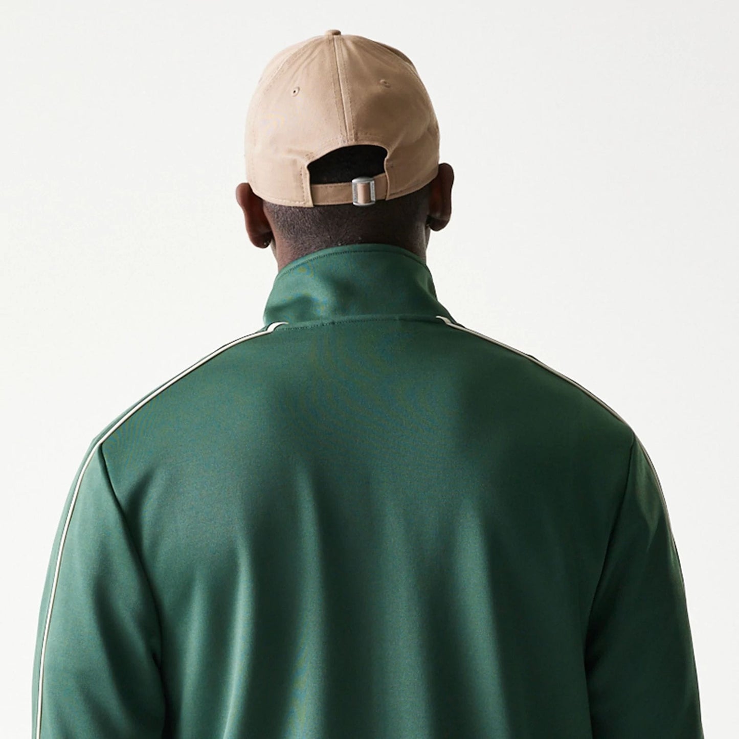 The model is wearing this MLB Piping LA Dodgers Track Jacket in dark green. 7