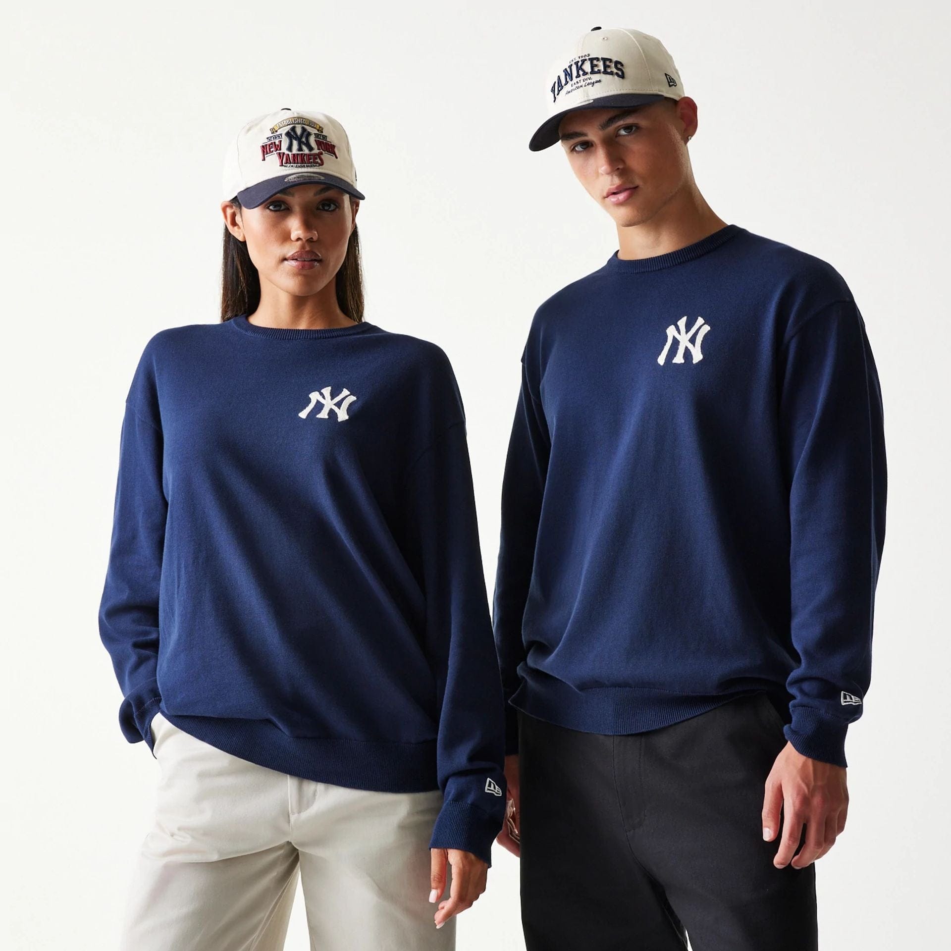 The model is wearing this MLB Essential New York Yankees Knitted Sweater in navy. 1