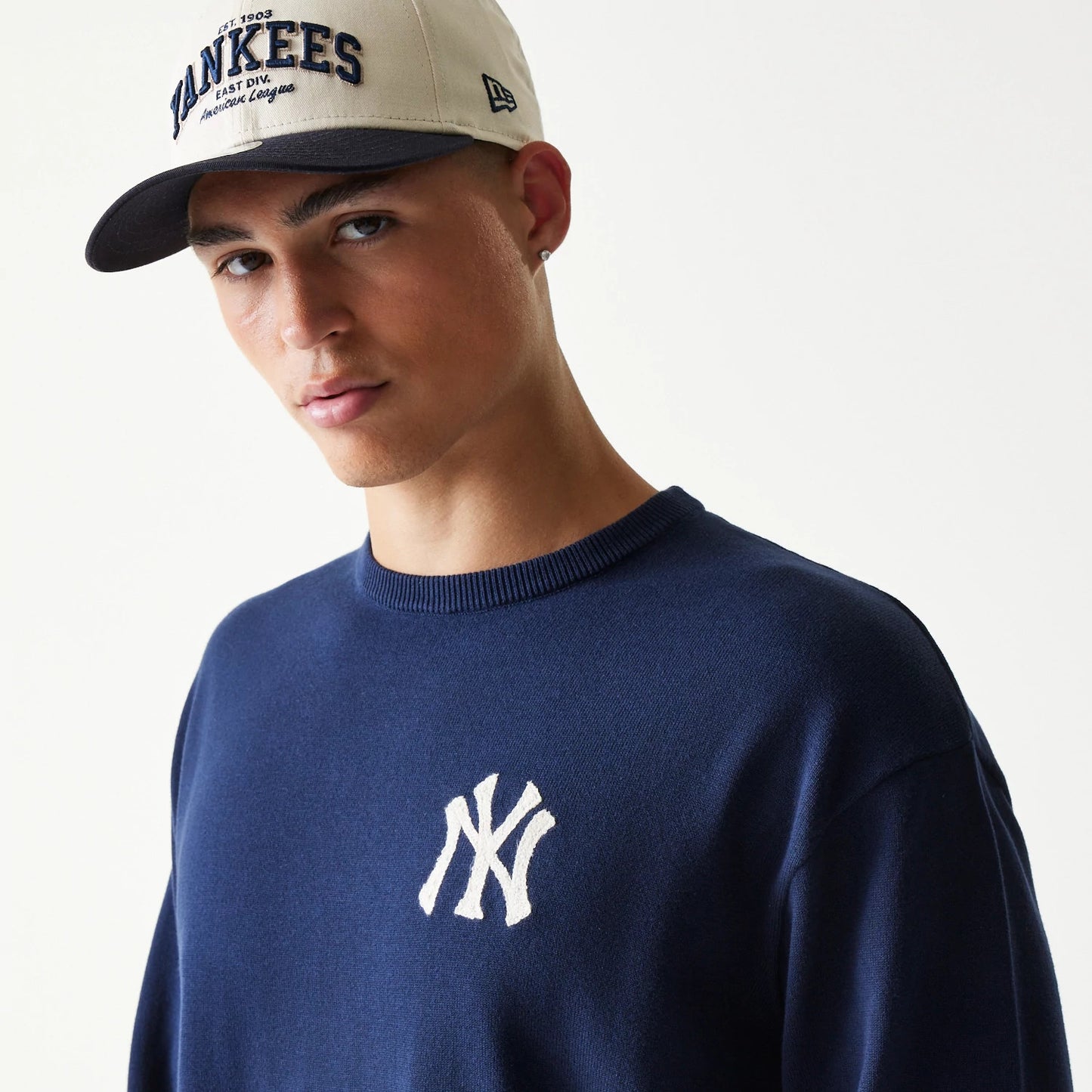 The model is wearing this MLB Essential New York Yankees Knitted Sweater in navy. 5