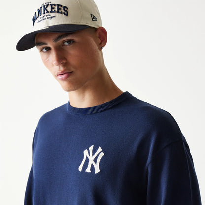 The model is wearing this MLB Essential New York Yankees Knitted Sweater in navy. 5