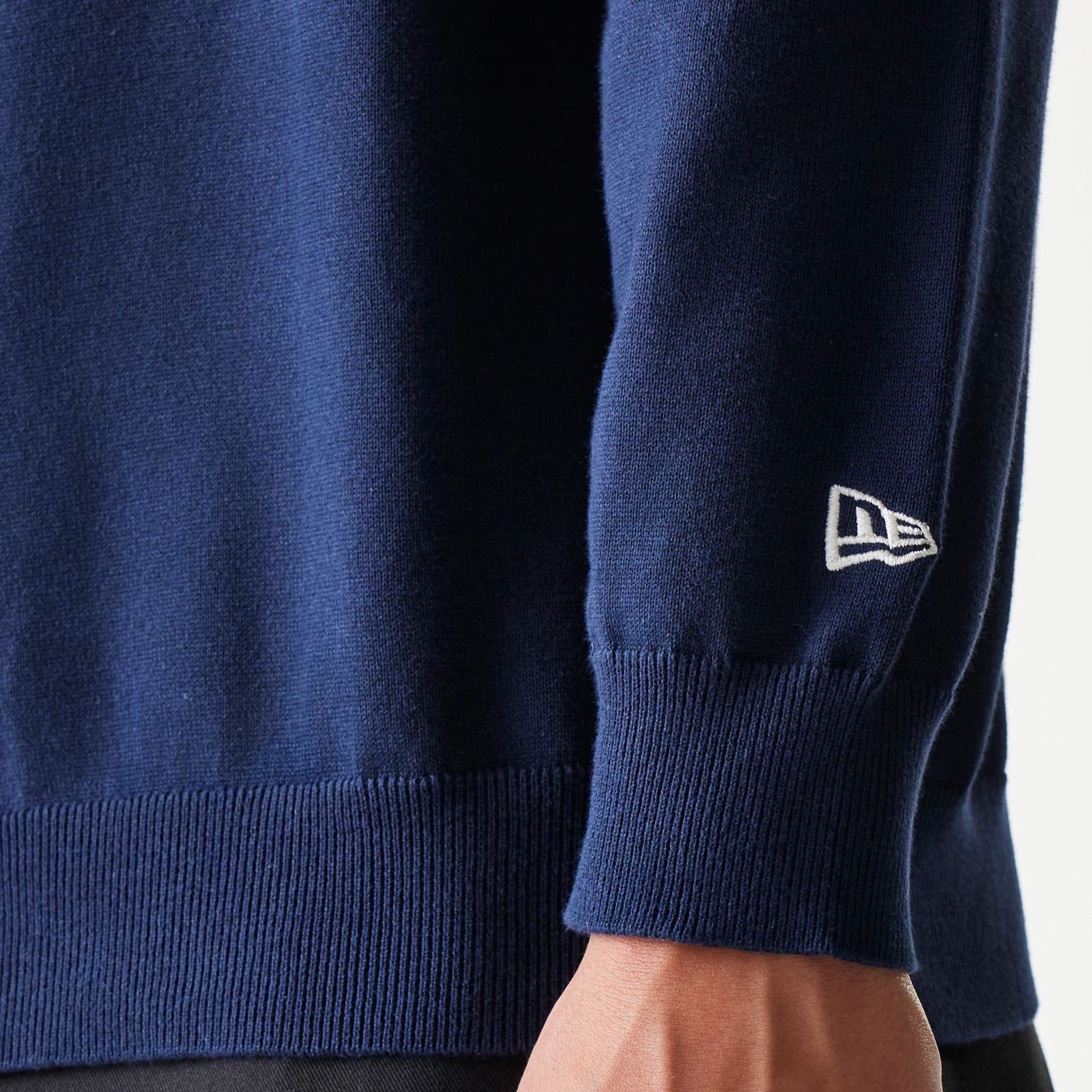 The model is wearing this MLB Essential New York Yankees Knitted Sweater in navy. 6