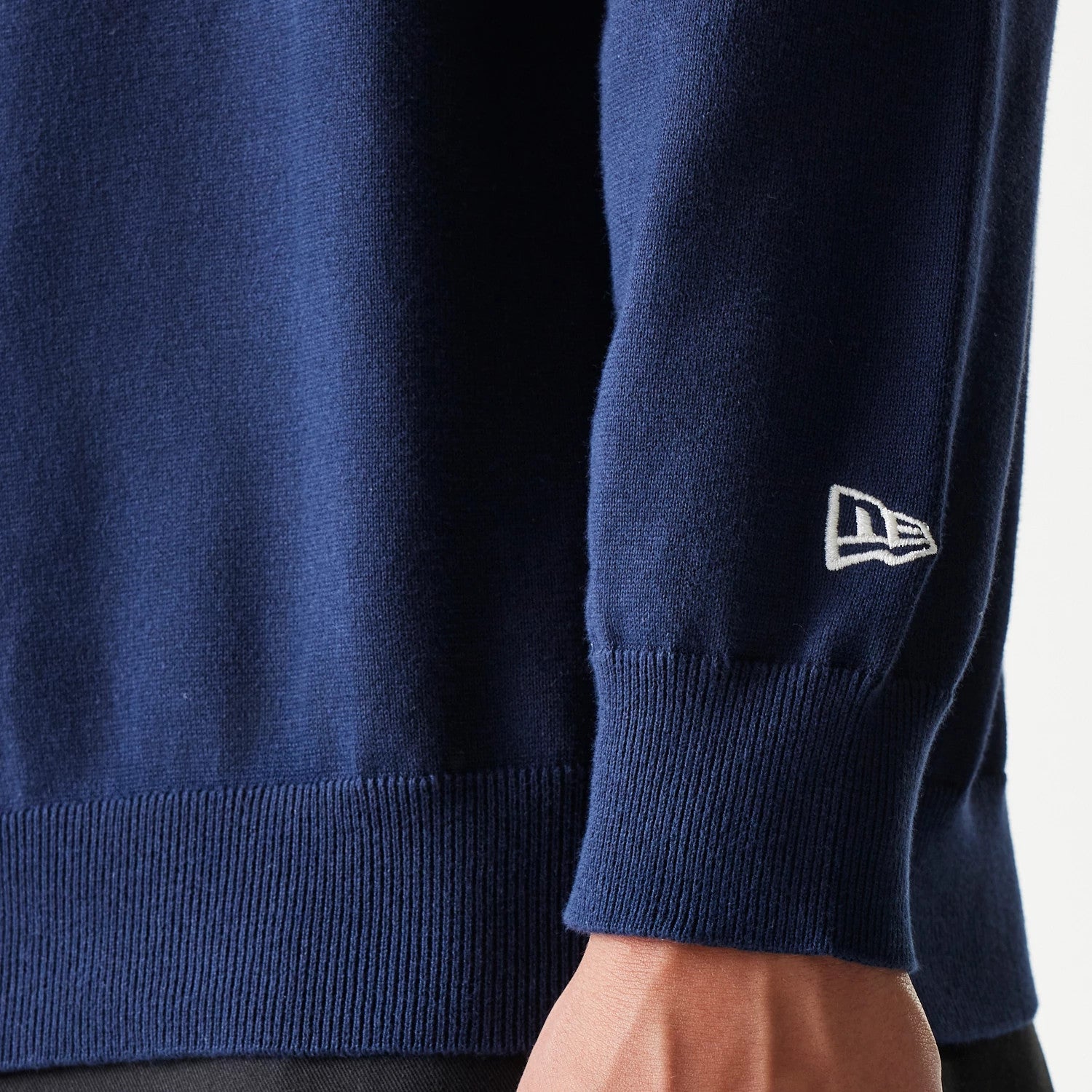 The model is wearing this MLB Essential New York Yankees Knitted Sweater in navy. 6