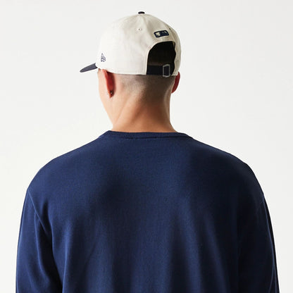 The model is wearing this MLB Essential New York Yankees Knitted Sweater in navy. 7