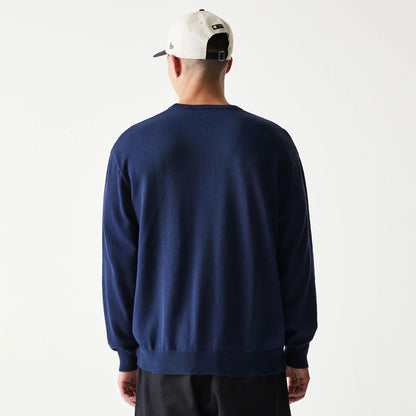 The model is wearing this MLB Essential New York Yankees Knitted Sweater in navy. 2