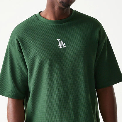 The model is wearing this MLB Waffle LA Dodgers Oversized T-Shirt in dark green. 4