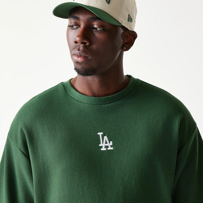 The model is wearing this MLB Waffle LA Dodgers Oversized T-Shirt in dark green. 7