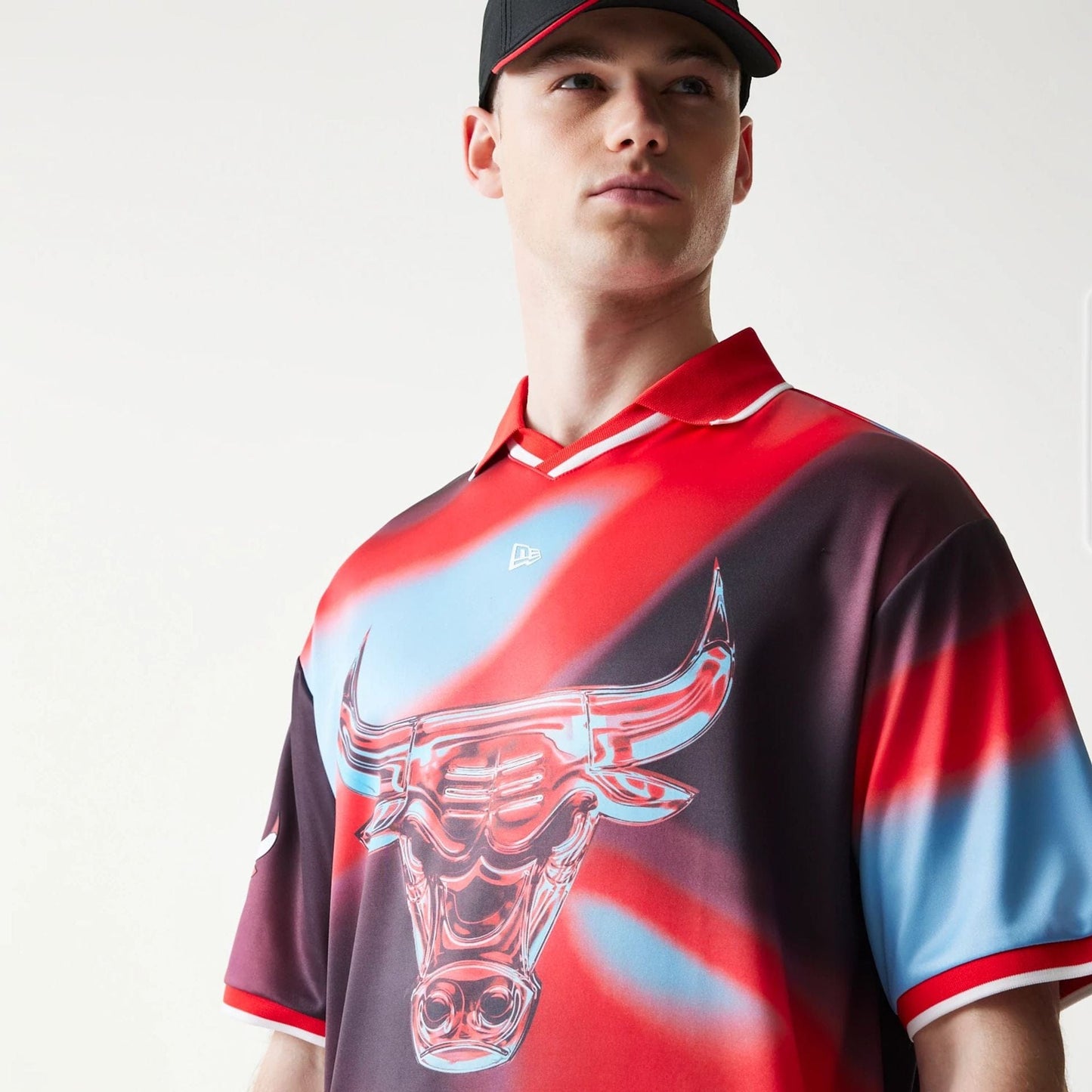 The model is wearing this NBA All Over Print Chicago Bulls T-Shirt in red. 4