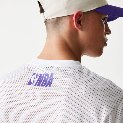 The model is wearing this NBA Graphic Mesh LA Lakers T-Shirt in white. 6