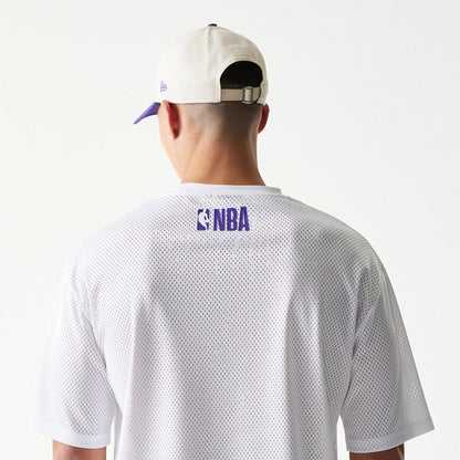 The model is wearing this NBA Graphic Mesh LA Lakers T-Shirt in white. 7