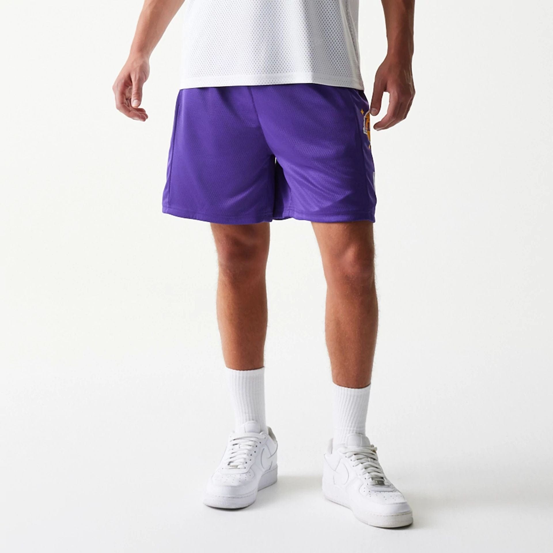 The model is wearing this NBA Mesh LA Lakers Shorts in purple. 3