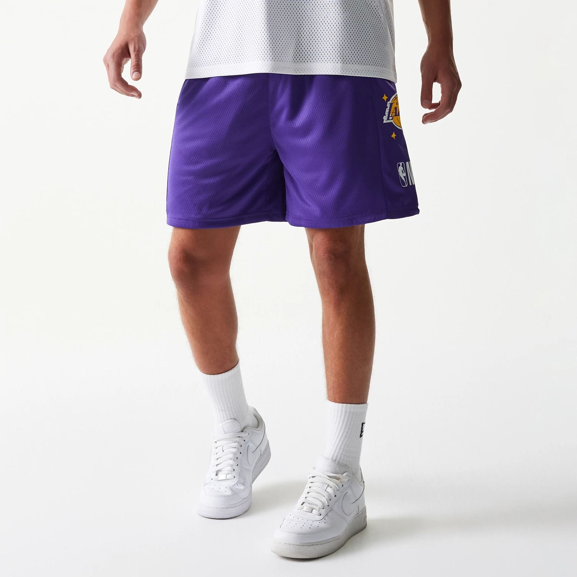 The model is wearing this NBA Mesh LA Lakers Shorts in purple. 1