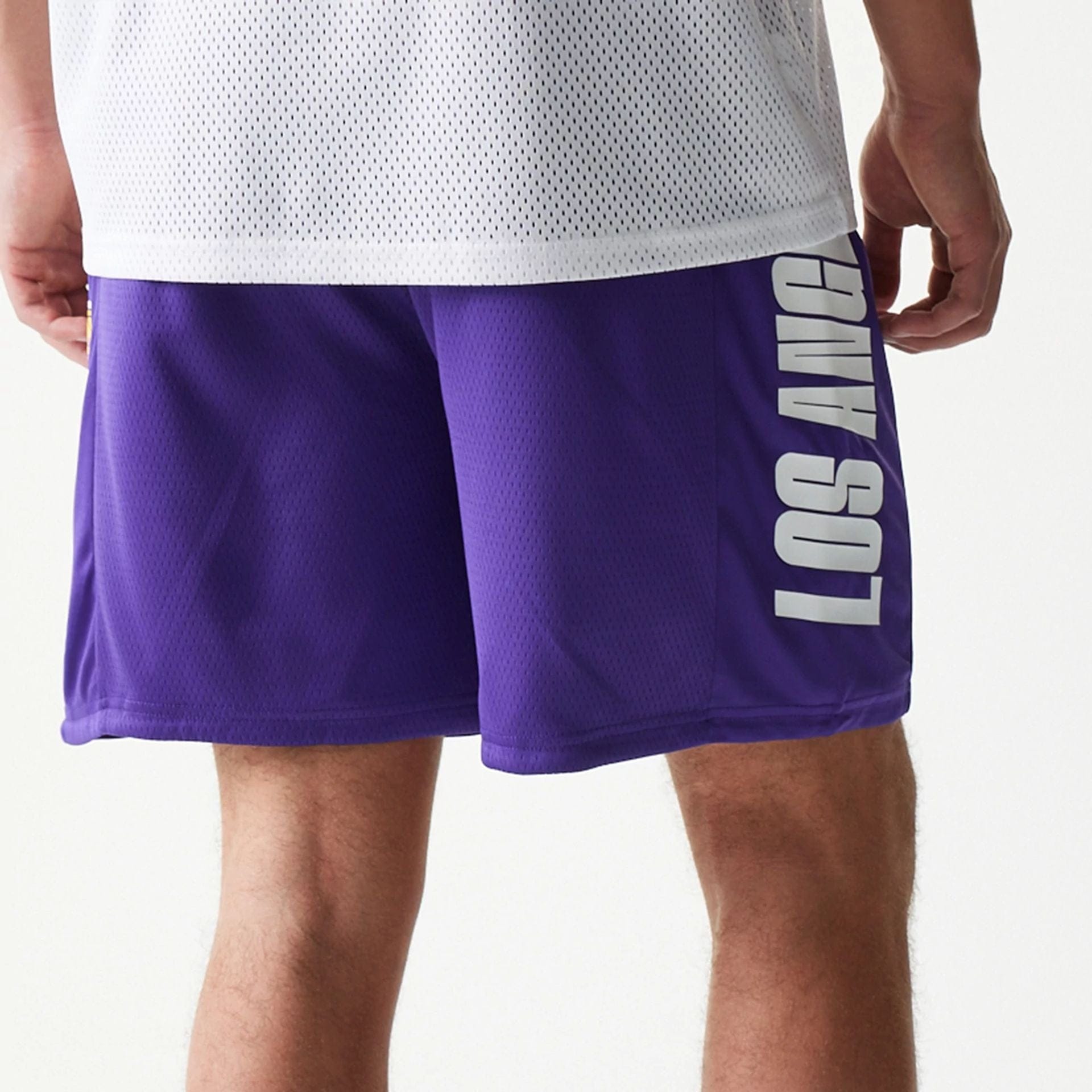 The model is wearing this NBA Mesh LA Lakers Shorts in purple. 7