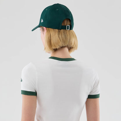 The model is wearing this Womens New Era Cropped Slim T-shirt in white. 7