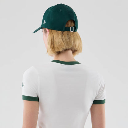 The model is wearing this Womens New Era Cropped Slim T-shirt in white. 7