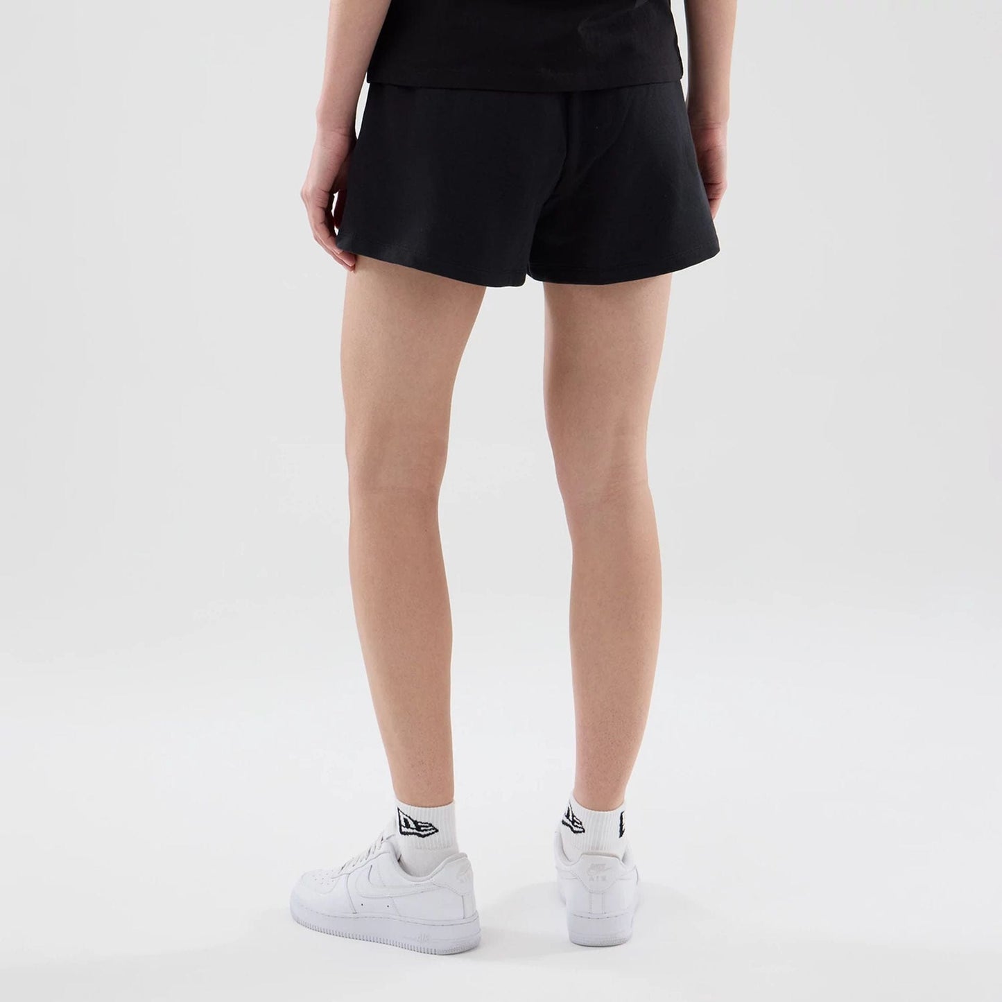The model is wearing this Womens MLB Infill New York Yankees Shorts in black. 2