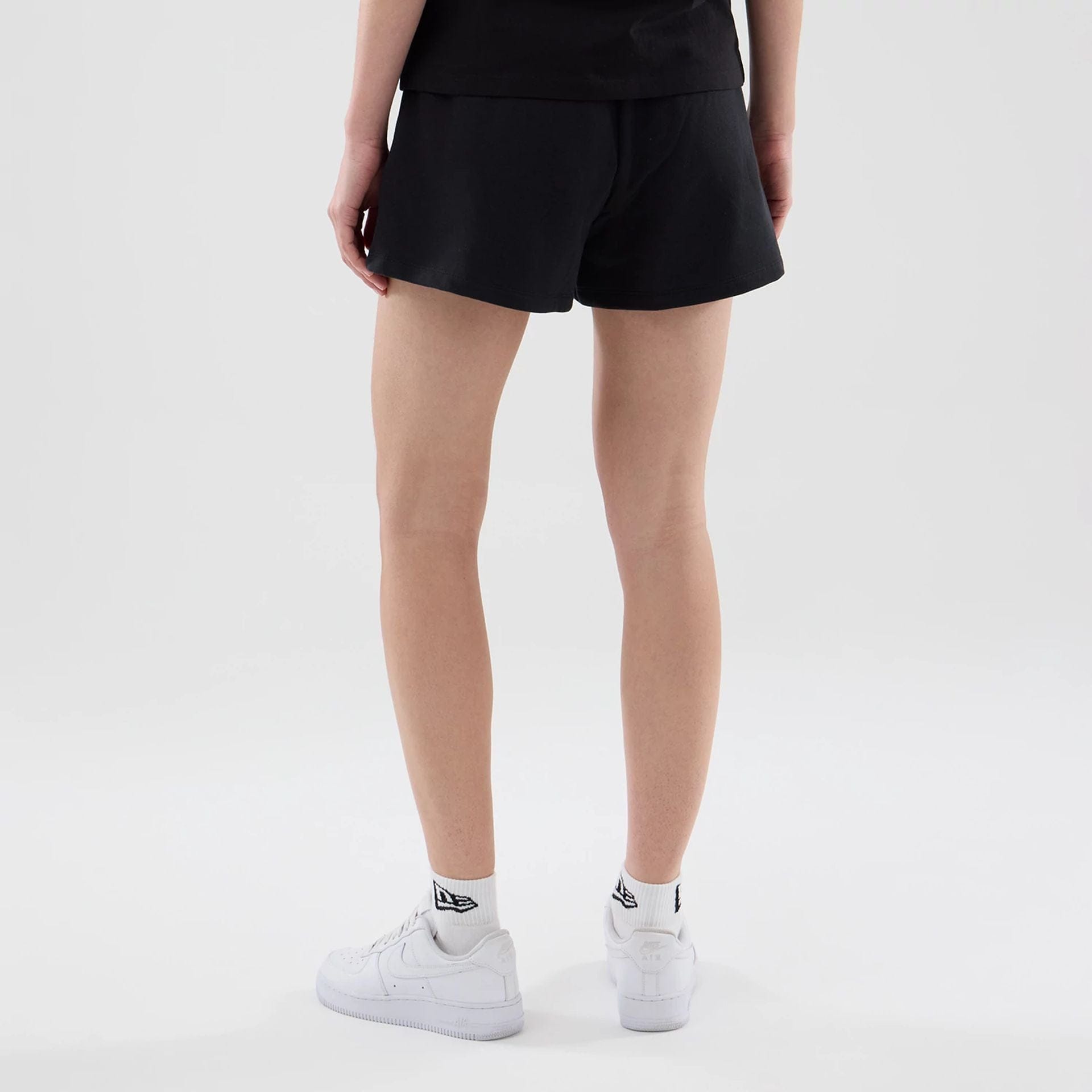 The model is wearing this Womens MLB Infill New York Yankees Shorts in black. 2