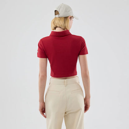 The model is wearing this Womens MLB New York Yankees Cropped Slim Polo T-shirt in dark red. 2