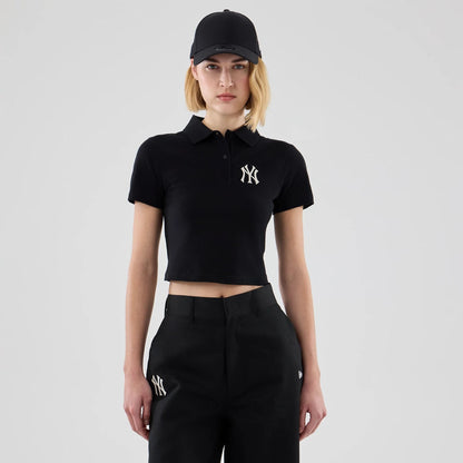The model is wearing this Womens MLB New York Yankees Cropped Slim Polo T-shirt in black. 1