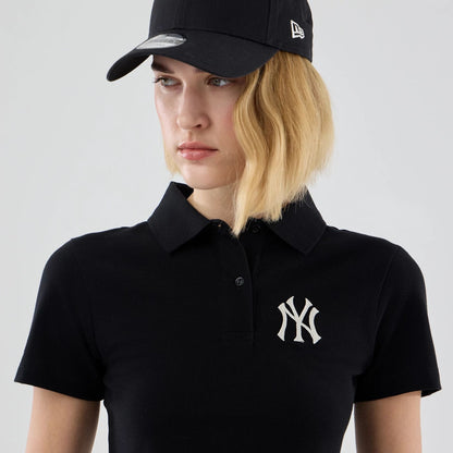 The model is wearing this Womens MLB New York Yankees Cropped Slim Polo T-shirt in black. 6