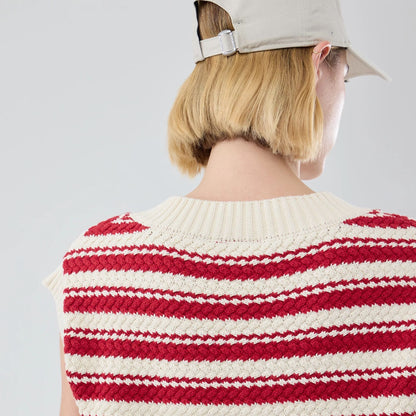 The model is wearing this Womens MLB Knit Stripe New York Yankees Sleeveless  V-neck Sweater in dark red. 7