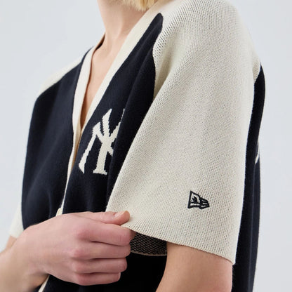 The model is wearing this Womens MLB Knit Stripe New York Yankees Short Sleeve Cardigan in black. 5
