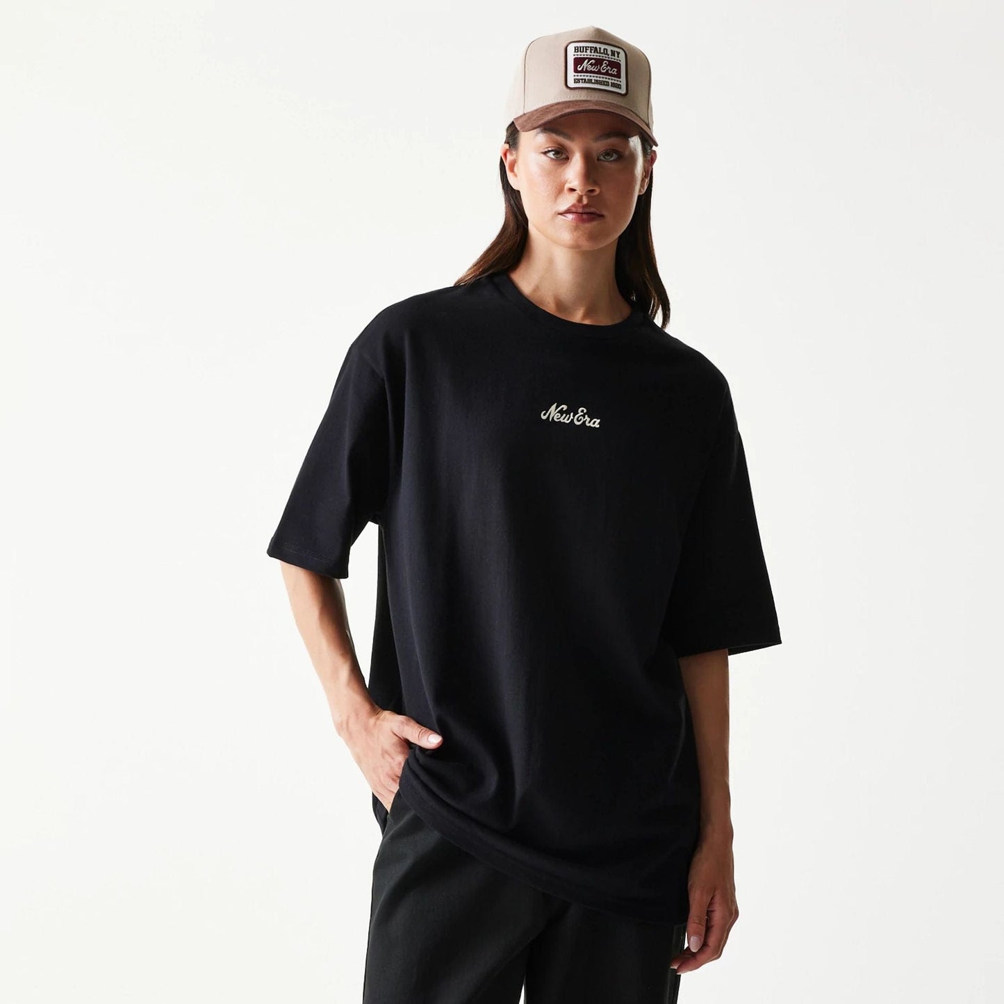 The model is wearing this New Era Script T-Shirt in black. 4