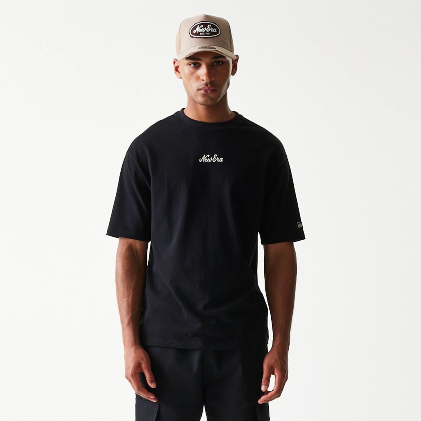 The model is wearing this New Era Script T-Shirt in black. 3