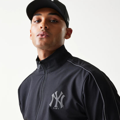 The model is wearing this MLB New York Yankees Track Jacket in black. 6