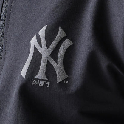 The model is wearing this MLB New York Yankees Track Jacket in black. 8
